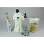 A Minton figure of 'The Sheikh', 25.5cm, together with a Lladro porcelain figure of a lady, 21cm,
