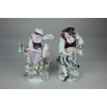 A pair of Sitzendorf porcelain figures of a shepherd and shepherdess, with applied floral