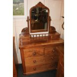 A Victorian dressing table, with mirror, two jewellery drawers, above two short drawers and two long