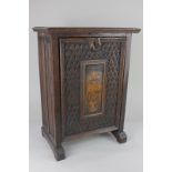 A carved oak stationary box, with linen panel sides, and hinged front with plaque bearing date 1624,