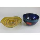 A studio glass dish, decorated with mottled swirling stripes of blue and yellow, indistinctly signed