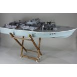 A MTB 385 model ship, scale 1/24 partially constructed kit, on stand with plans (a/f), 96cm long