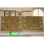 A near pair of Persian style wool rugs with floral design on yellow ground 120cm by 184cm