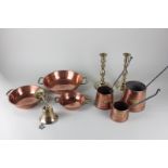 A set of three graduated copper cider measures, a set of three graduated copper with two brass