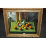 Gavin Nicol (20th century), still life of fruit, jug and saucer on green tablecloth, oil on board,