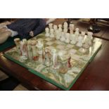 A large carved onyx chess set and board, purchased in the Middle East, King 15.5cm high