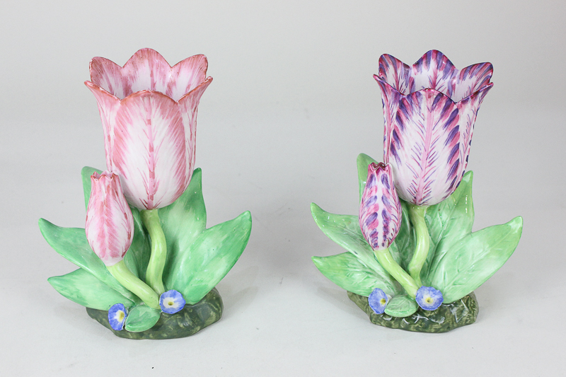 Two similar 19th century style porcelain vases modelled as tulips with pink and purple petals, the