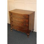 A 20th century walnut bowfront chest of four drawers, on cabriole feet, 83cm