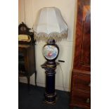 A modern blue glazed pottery table lamp, baluster shape with floral panel, a matching column