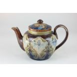 A Doulton Lambeth pottery teapot by Eliza Simmance, decorated with stylized daffodils, incised