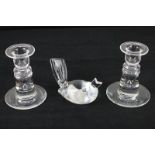 A pair of Steuben Crystal candlesticks, 11cm high, together with a Steuben model of a bird