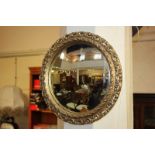 A circular convex wall mirror with pierced gilt frame, mirror plate 24cm diameter