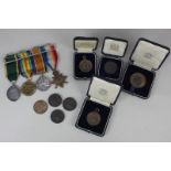 A group of four First World War medals, the Victory medal, the War medal, the 1914-15 Star and the