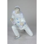 A Lladro porcelain figure of a clown, in dramatic pose, 26cm