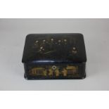 A Chinese black lacquer box depicting men gathered in a garden, 19.5cm