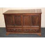 An 19th century oak mule chest, with four panel front and two drawers, on bracket feet, 126.5cm