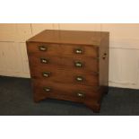 A Campaign style metal mounted chest of four drawers, with flush brass handles, and brass side