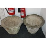 A pair of octagonal composite garden planters, decorated in light relief with stone design, 41.5cm