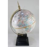 A table top globe, by Replogle, marked '12 inch diameter Globe, World Classic series', with gilt