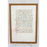 A framed vellum page, written in Latin, the verso inscribed 'Vellum page from a Ferrarese book of