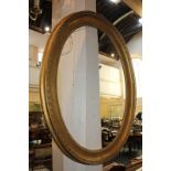 A gesso and giltwood oval picture frame, possibly Italian, 81cm by 62.5cm