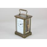 A brass and bevelled glass cased carriage clock, the dial marked Matthew Norman, London, with