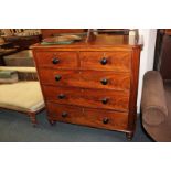 A Victorian mahogany chest of two short over three long drawers, with knob handles, on turned