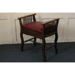 A Victorian piano stool, with rising box seat, and arm rests on spindle supports, 57cm