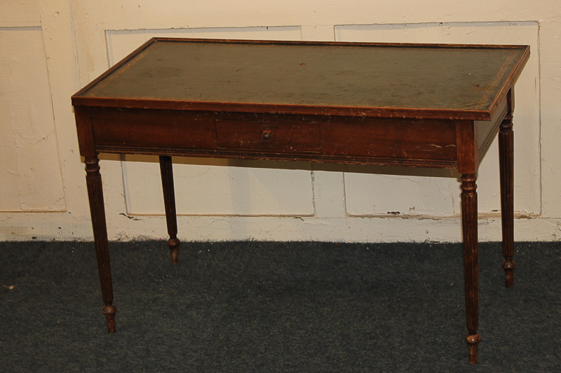 A reproduction rectangular side table with green leather top, small central drawer, on fluted