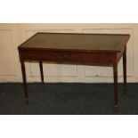 A reproduction rectangular side table with green leather top, small central drawer, on fluted
