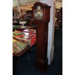 A walnut cased Grandmother clock by Elliott, retailed by John Walker, London, the domed brass and