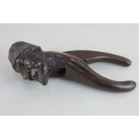 A continental novelty carved wood nutcracker, in the form of a head of a bearded man, 20cm