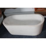 A white granite sink or planter, shaped rectangular form with drain hole, 70.5cm