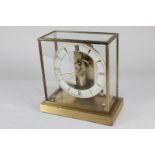 A Junghans Ato mantel clock in square glass and brass case, 22cm
