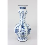 A Dutch Delft blue and white vase, of faceted baluster form, decorated with panels of sailing