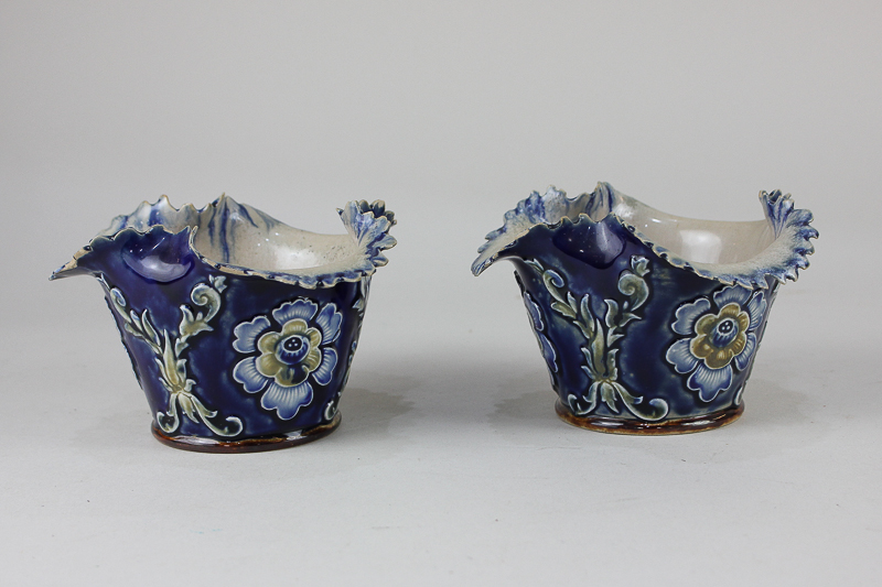 A pair of Doulton Lambeth pottery vases, possibly by Elizabeth Atkins, each with frilled rim,