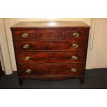A 19th century mahogany chest of three short over three long graduated drawers, with brass oval drop
