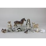 A collection of USSR Lomonosov and Szeiler porcelain models of animals including a horse, a zebra,