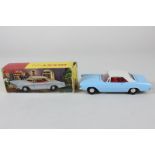 A Hong Kong Dinky Toys Buick Riviera 57/001 with blue body, white roof and red interior, in original