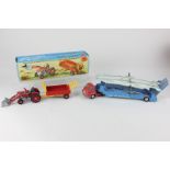 A Corgi Toys die cast Massey-Ferguson 165 tractor and trailer with shovel and two detachable