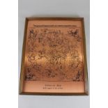 A copper reproduction of a celestial map with signs of the zodiac, framed, 38cm by 29cm, purchased