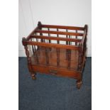 A Victorian mahogany Canterbury magazine rack, with four divisions, drawer and turned supports, on