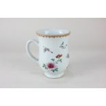 A Chinese porcelain tankard with butterfly and floral decoration (a/f), 14cm high