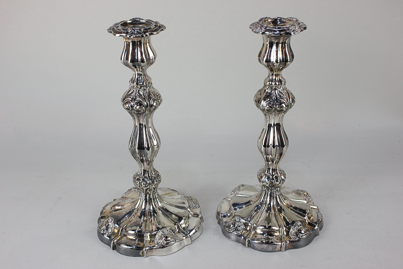 A pair of silver plated candlesticks with embossed leaf design, 25.5cm high