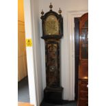 A George III longcase clock by Joseph Davis London, with 12 inch arched brass dial with maker's
