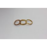 Two 22ct gold wedding rings, 9.4g, and a 9ct gold ring, 3.7g