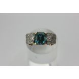 An Art Deco blue zircon and diamond ring on rose and white gold