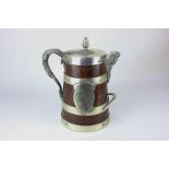 A late Victorian plate mounted wooden trophy tankard with porcelain liner, mask spout, acorn finial,