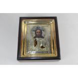 A Russian icon of Christ, with gilt metal oklad, in glazed box frame, panel 16.5cm by 14cm