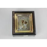 A Russian icon of the Madonna and child, with silver gilt oklad, in glazed box frame, panel 9cm by